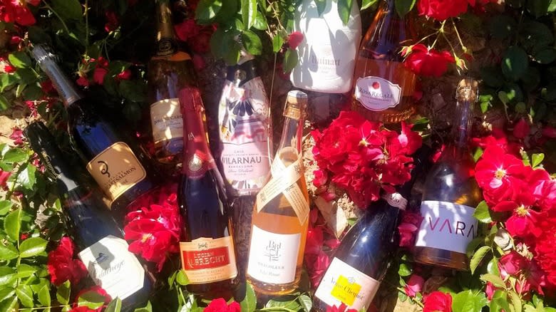 Bottles of rose with roses