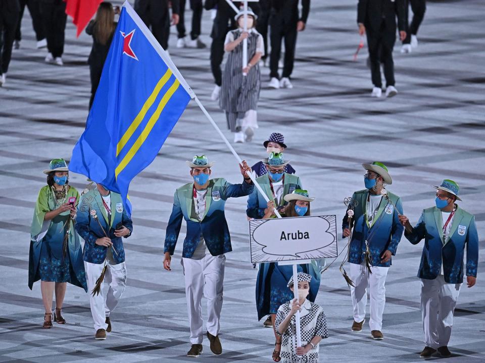 Athletes from Aruba make their entrance at the Summer Olympics.