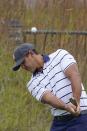 Team USA's Brooks Koepka chips to a practice green during a practice day at the Ryder Cup at the Whistling Straits Golf Course Tuesday, Sept. 21, 2021, in Sheboygan, Wis. (AP Photo/Jeff Roberson)