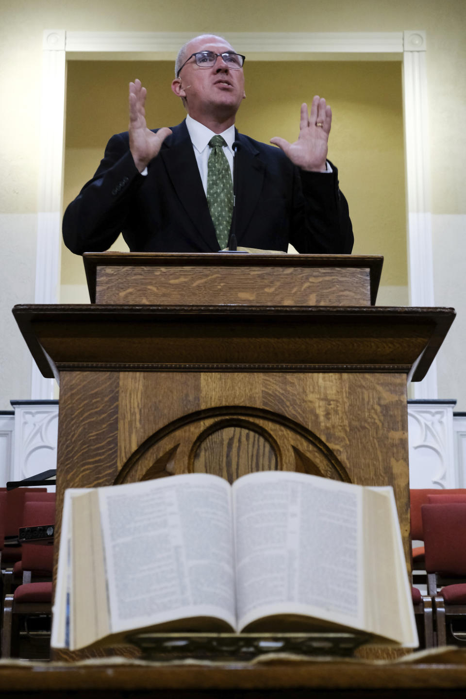 A Bible rests open on a table in front of the pulpit as Bart Barber preaches to members of the First Baptist Church of Farmersville, Texas, on Sunday, Sept. 25, 2022. After recently appointing an sexual abuse task force that will make recommendations at next year’s annual meeting in New Orleans, he said Southern Baptists are determined that there must be reforms and identifying solutions to the problem is his top priority. (AP Photo/Audrey Jackson)