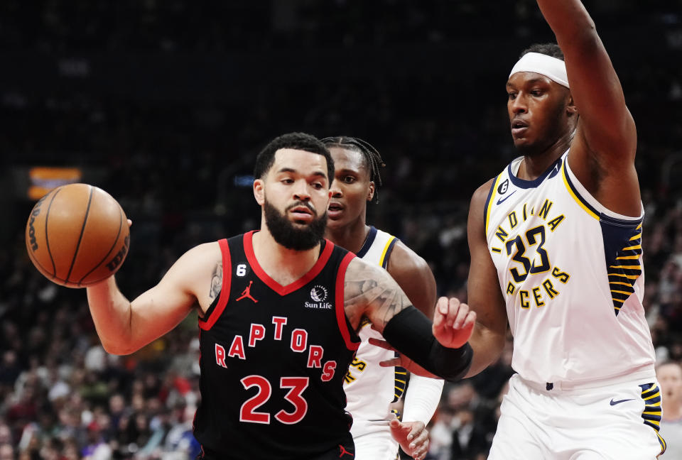 Toronto Raptors guard Fred VanVleet (23) protects the ball as Indiana Pacers center Myles Turner (33) defends during the first half of an NBA basketball game in Toronto, Wednesday, March 22, 2023. (Frank Gunn/The Canadian Press via AP)
