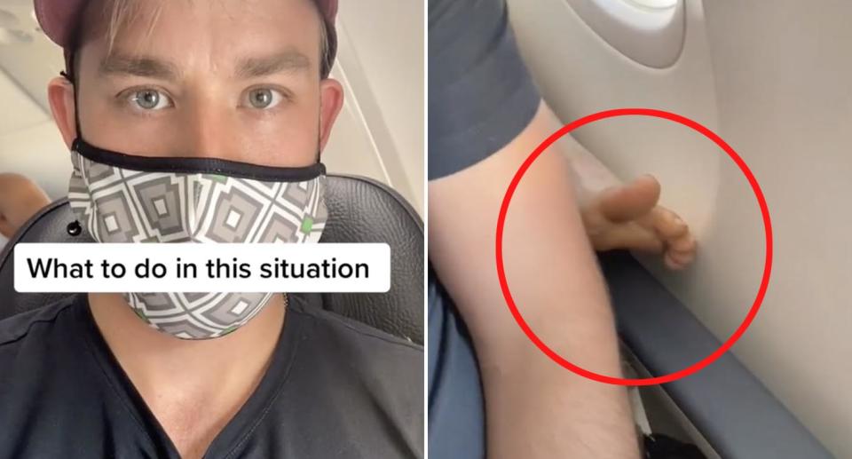 A man sits on a plane as a passenger seated behind him puts their bare feet up on the foot rest. 