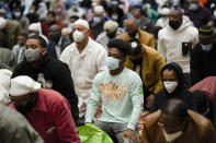 Worshippers perform an Eid al-Fitr prayer at the Masjidullah Mosque in Philadelphia, Thursday, May 13, 2021. Millions of Muslims across the world are marking a muted and gloomy holiday of Eid al-Fitr, the end of the fasting month of Ramadan - a usually joyous three-day celebration that has been significantly toned down as coronavirus cases soar. (AP Photo/Matt Rourke)