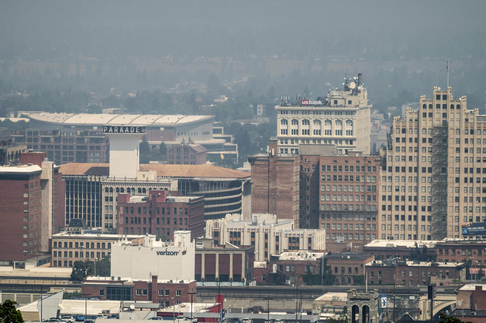 Smoke from area wildfires blankets downtown Spokane, Wash, Saturday, July 10, 2021. (Colin Mulvany/The Spokesman-Review via AP)