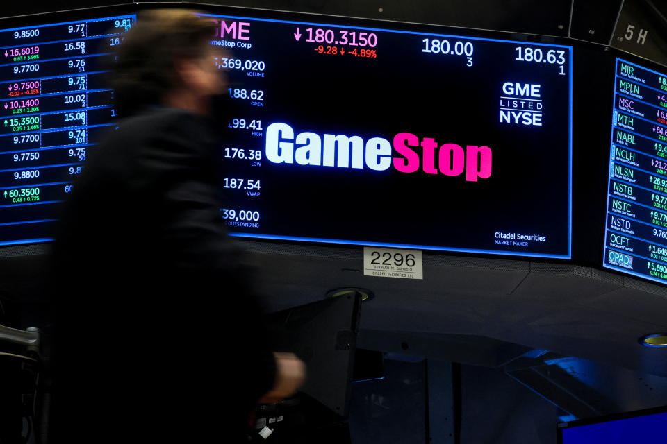 A screen displays the logo and trading information for GameStop on the floor of the New York Stock Exchange (NYSE) in New York City, U.S., March 29, 2022.  REUTERS/Brendan McDermid