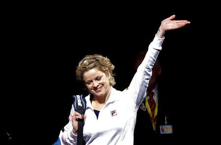 FILE PHOTO: Belgium's Kim Clijsters waves as she arrives to play an exhibition tennis match against Venus Williams of the U.S., marking the end of Clijsters' professional career in Antwerp December 12, 2012. REUTERS/Francois Lenoir /File Photo