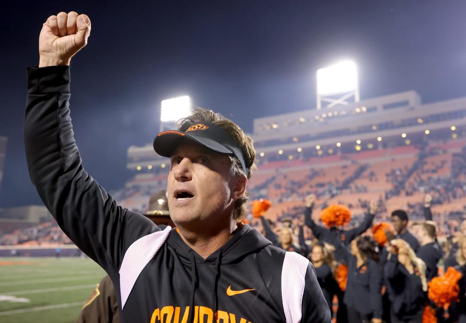 OSU head coach Mike Gundy acknowledges the crowd following a 29-21 win against Kansas State on Oct. 6 at Boone Pickens Stadium in Stillwater.