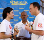 <p>Current world record holder Joey Chestnut (R) stares down with top contender Matt Stonie during the official weigh-in ceremony for the Nathan’s Famous Fourth of July International Hot Dog Eating Contest in Brooklyn, New York City, U.S., July 3, 2017. (Brendan McDermid/Reuters) </p>