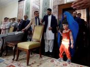 Sharbat Gula (R), the green-eyed "Afghan Girl" whose 1985 photo in National Geographic became a symbol of her country's wars, arrives to meet with Afghanistan's President Ashraf Ghani in Kabul, Afghanistan November 9, 2016. REUTERS/Mohammad Ismail