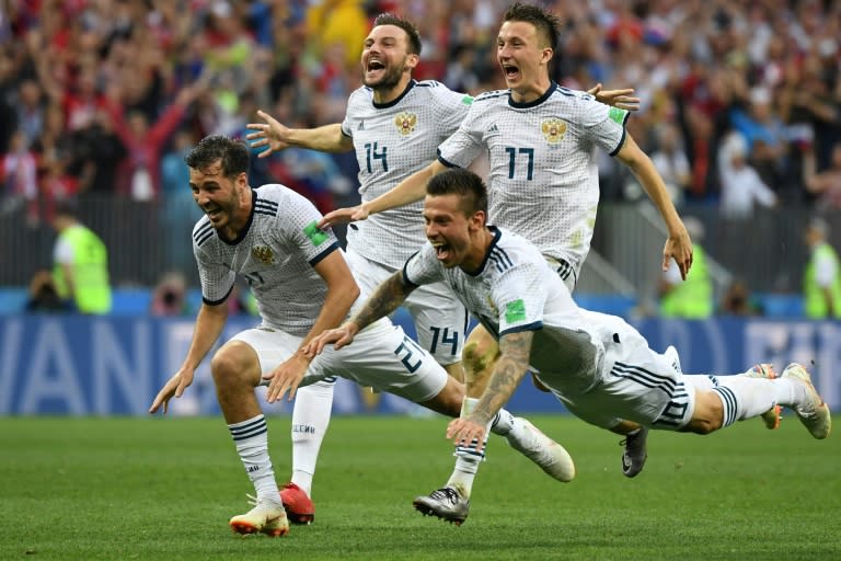 Russia celebrate their victory against Spain on penalties to reach the World Cup quarter-finals