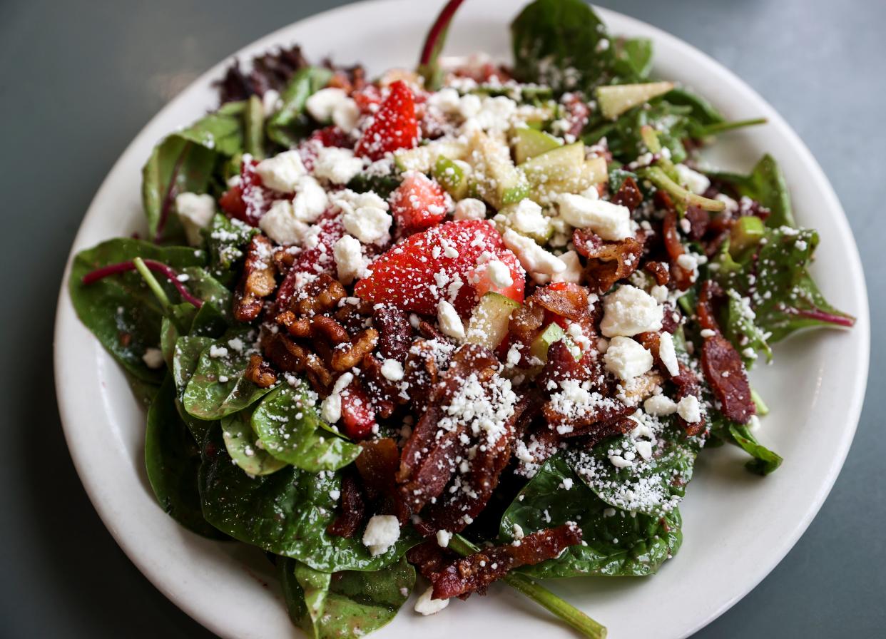 All Good Things' fruity salad is made with seasonal fruit, bacon, feta, candied pecans and a strawberry vinaigrette.