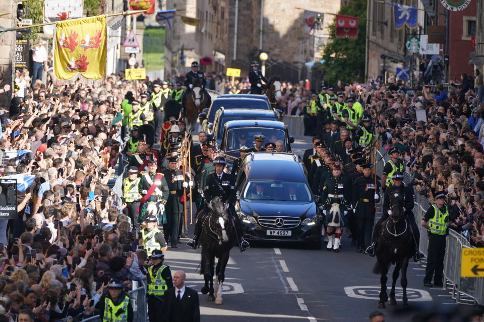 King Charles III, Princess Anne and members of the Royal family join the procession of Queen Elizabeth II's coffin from the Palace of Holyroodhouse to St Giles' Cathedral, in Edinburgh, Monday, Sept. 12, 2022. King Charles arrived in Edinburgh on Monday to accompany his late mother’s coffin on an emotion-charged procession through the historic heart of the Scottish capital to the cathedral where it will lie for 24 hours to allow the public to pay their last respects. (Andrew Milligan/Pool Photo via AP)