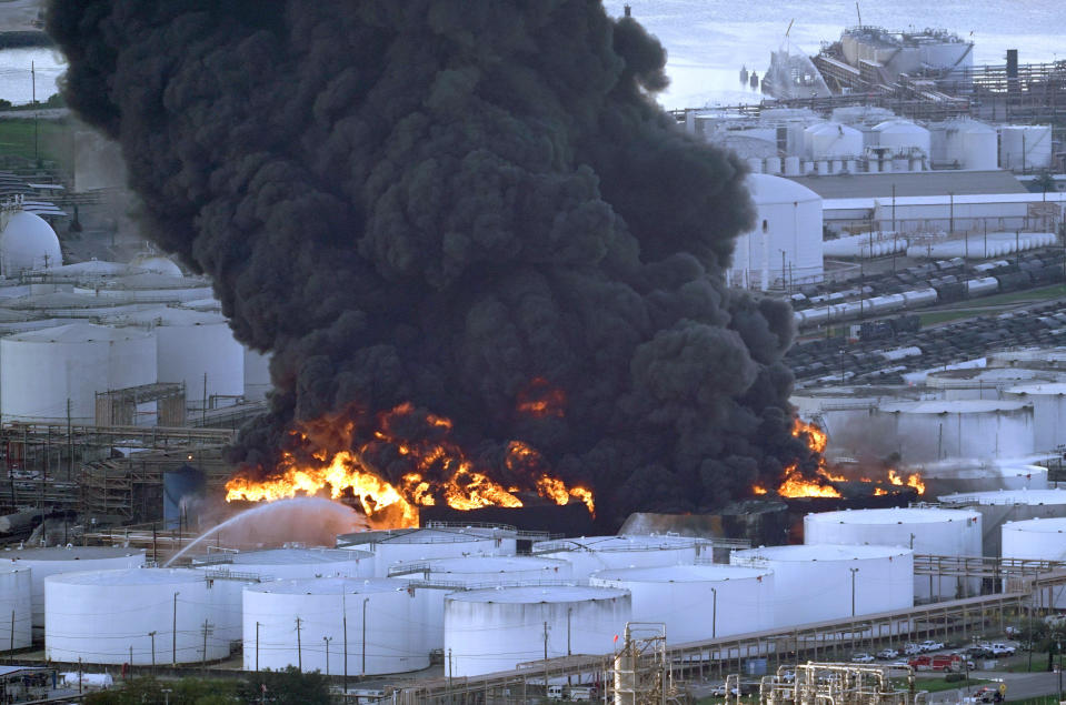 FILE - In this Monday, March 18, 2019 file photo, Firefighters battle a petrochemical fire at the Intercontinental Terminals Company in Deer Park, Texas. A fire at a Houston-area petrochemical storage facility that burned for days in March was accidental and caused by equipment failure at a storage tank, according to a report released by local and federal investigators, Friday, Dec. 6, 2019 (AP Photo/David J. Phillip, File)