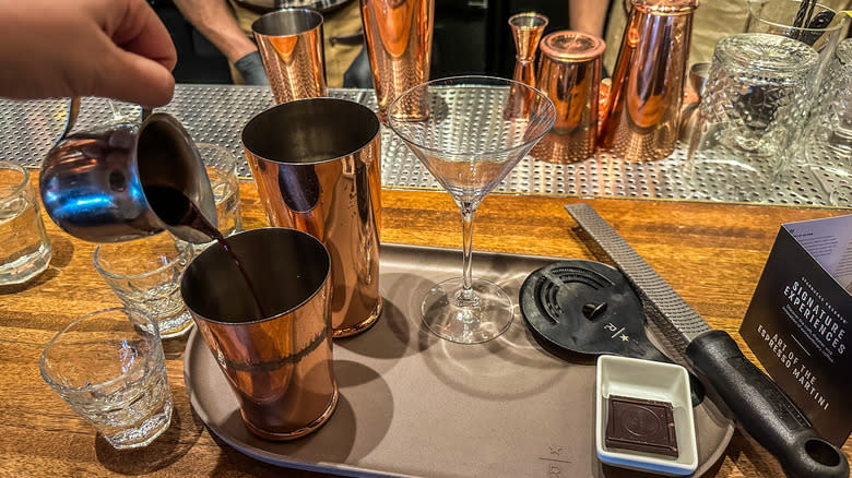 pouring espresso into a shaker