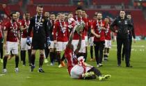 Britain Soccer Football - Southampton v Manchester United - EFL Cup Final - Wembley Stadium - 26/2/17 Manchester United's Eric Bailly slides with the trophy as hes celebrates winning the EFL Cup Final Reuters / Darren Staples Livepic