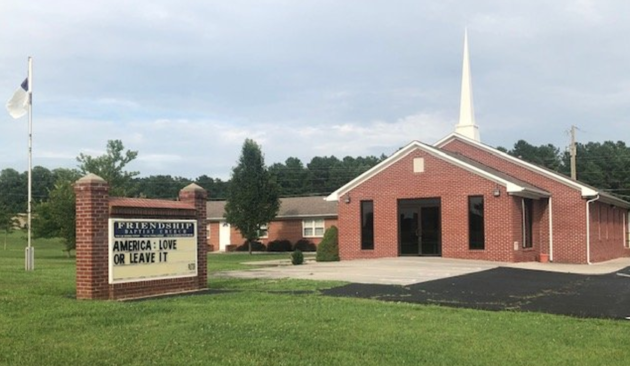 A congregation walked out during Sunday service in response to a sign put up by the pastor which read, "America: Love it or leave it." (Photo: Twitter)