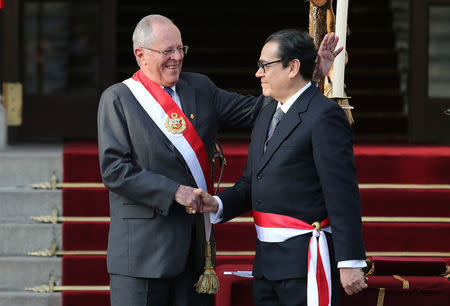 Peru's President Pedro Pablo Kuczynski and new Minister of Justice Javier Enrique Mendoza shake hands during his swearing-in ceremony at the government palace in Lima, Peru September 17, 2017. REUTERS/Guadalupe Pardo