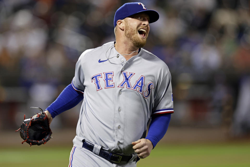 Texas Rangers pitcher Will Smith reacts after the final out by the New York Mets during the eighth inning of a baseball game Tuesday, Aug. 29, 2023, in New York. (AP Photo/Adam Hunger)