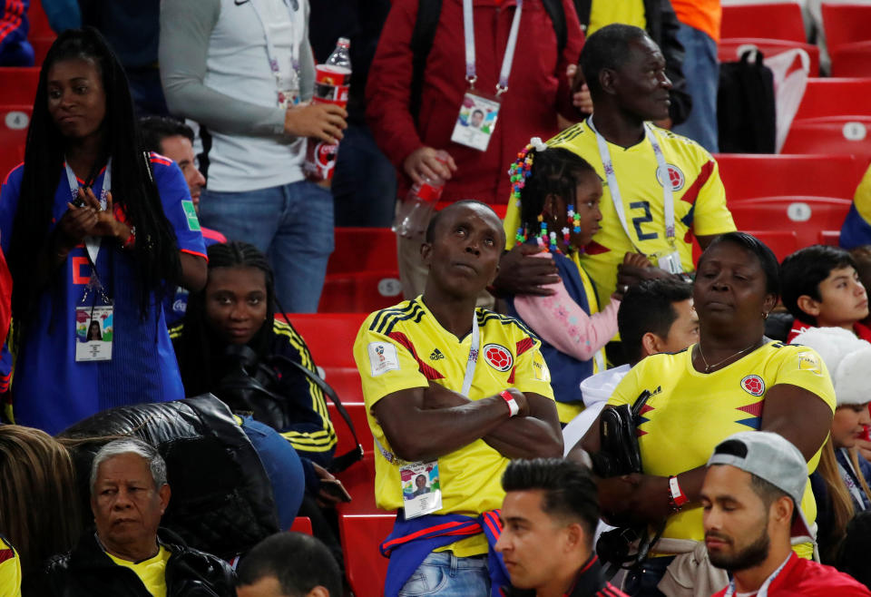 <p>Colombia fans look dejected after the match. REUTERS/Maxim Shemetov </p>