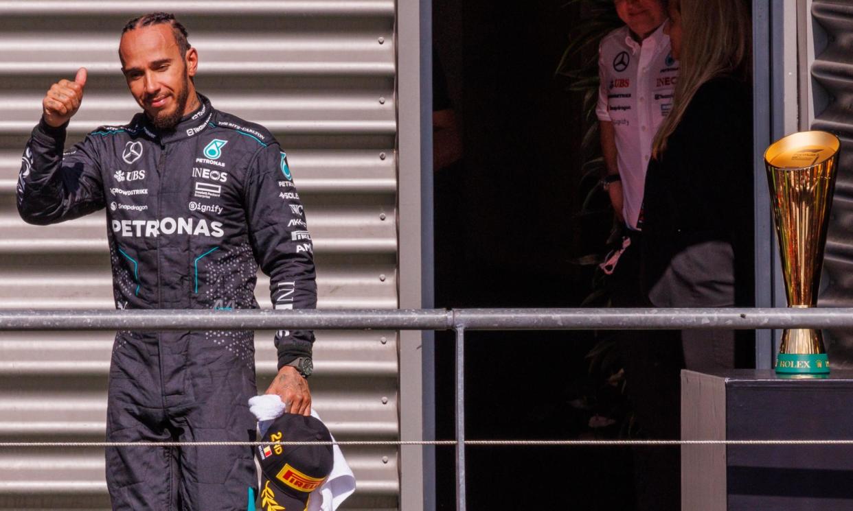 <span>Mercedes driver Lewis Hamilton reacts after the race at Spa before being promoted to first place.</span><span>Photograph: Olivier Matthys/EPA</span>