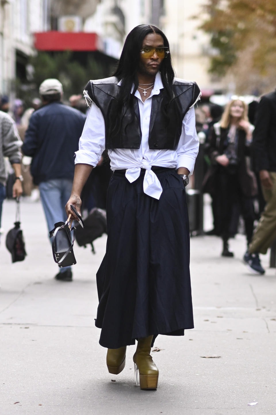 Law Roach in white button-down, skirt, vest, and heels