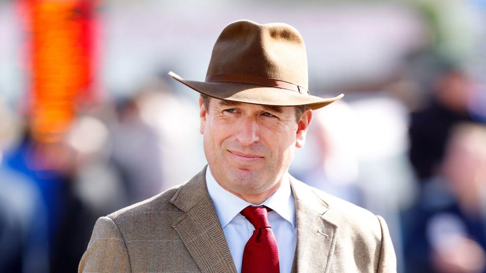 man in tweed suit and brown hat 