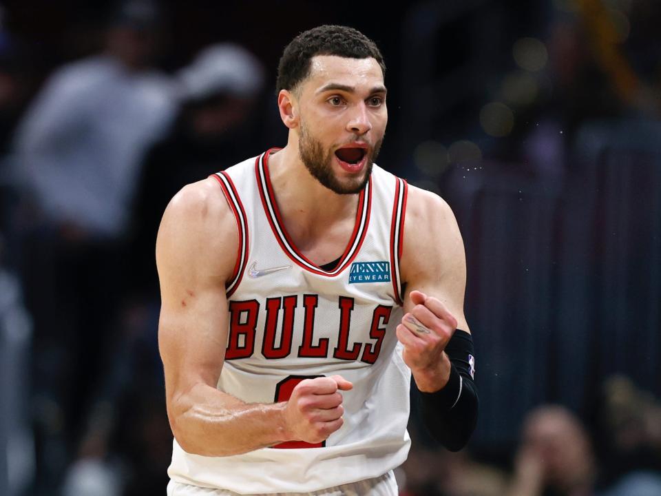 Zach Lavine clenches his fists and yells during a game.