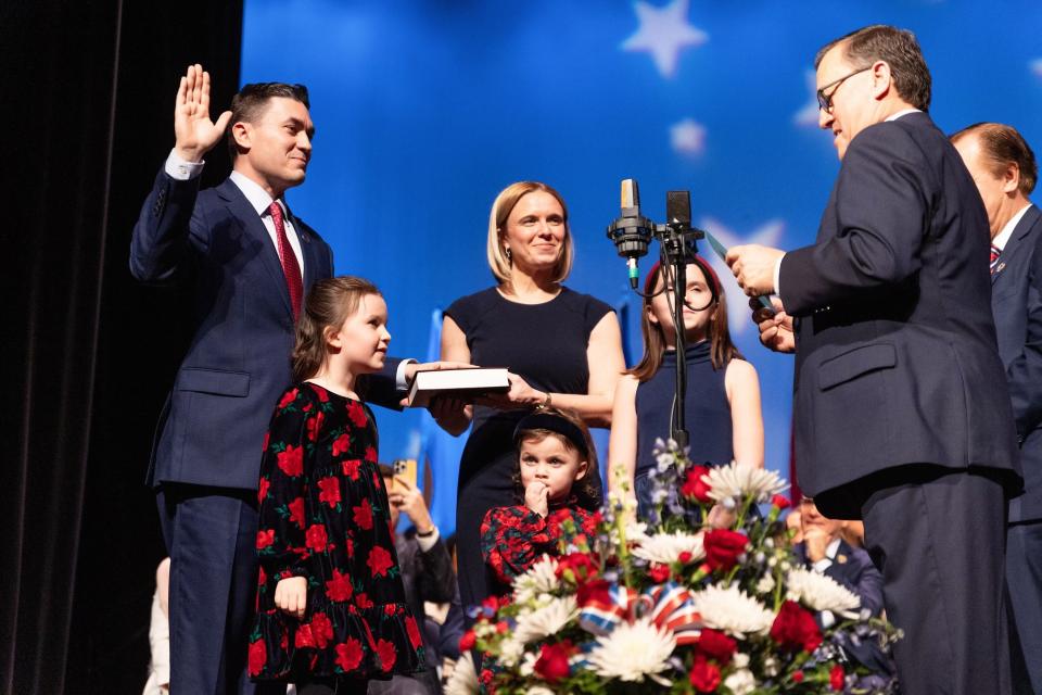 Former Chester Township Mayor Michael Inganamort, left, takes the oath of office as District 24 Assemblyman from Assembly Minority Leader John John DiMaio at the Trenton War Memorial. With him are his wife, Lauren, and their daughters (left to right) Sadie, Madeline and Ella.
