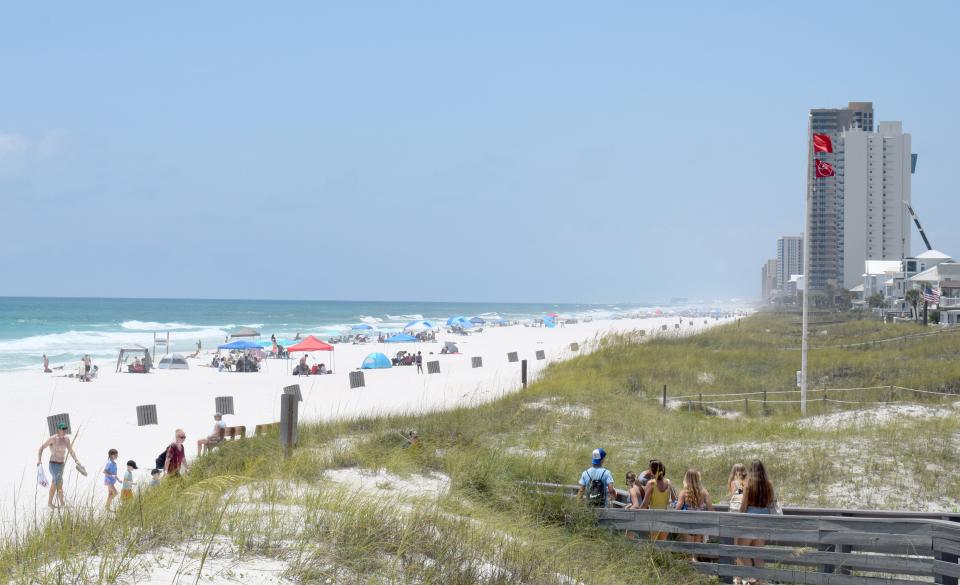 Despite double red flags posted, the beaches were packed on Friday near the Russell-Fields Pier in Panama City Beach.