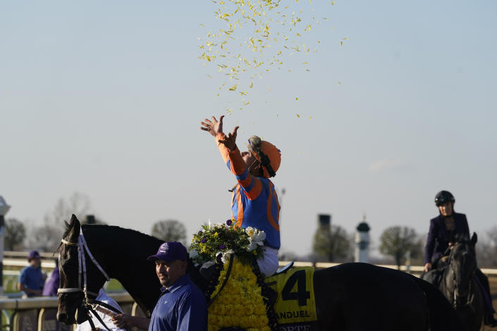 Irad Ortiz Jr. celebrates after riding Forte to victory during the Breeders' Cup Juvenile race at the Keenelend Race Course, Friday, Nov. 4, 2022, in Lexington, Ky. (AP Photo/Darron Cummings)