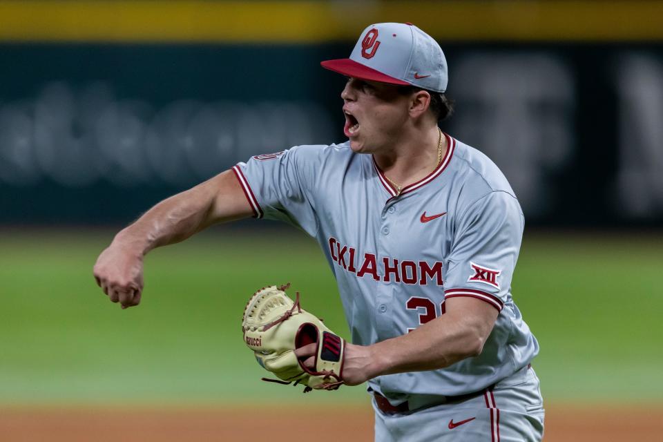 Oklahoma pitcher Brendan Girton (30) celebrates a diving catch made by outfielder Kendall Pettis to end the inning during an NCAA baseball game against Tennessee on Saturday, Feb. 17, 2024, in Arlington, Texas. (AP Photo/Brandon Wade)