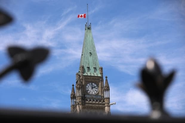 The flag at the Peace Tower in Ottawa flies at half-mast Sunday in memory of the 215 children whose remains were found at the site of a former residential school in Kamloops, B.C. (Olivier Hyland/CBC - image credit)