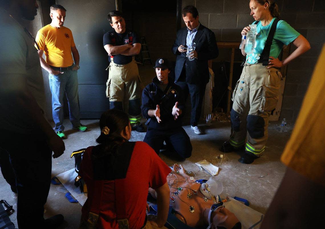 Capt. Trent Robinson of the Fort Worth Fire Department’s Emergency Medical Service, center, demonstrates CPR during a training session on Friday. City officials were invited to participate in a training session to learn what firefighters face on a day-to-day basis. Amanda McCoy/amccoy@star-telegram.com