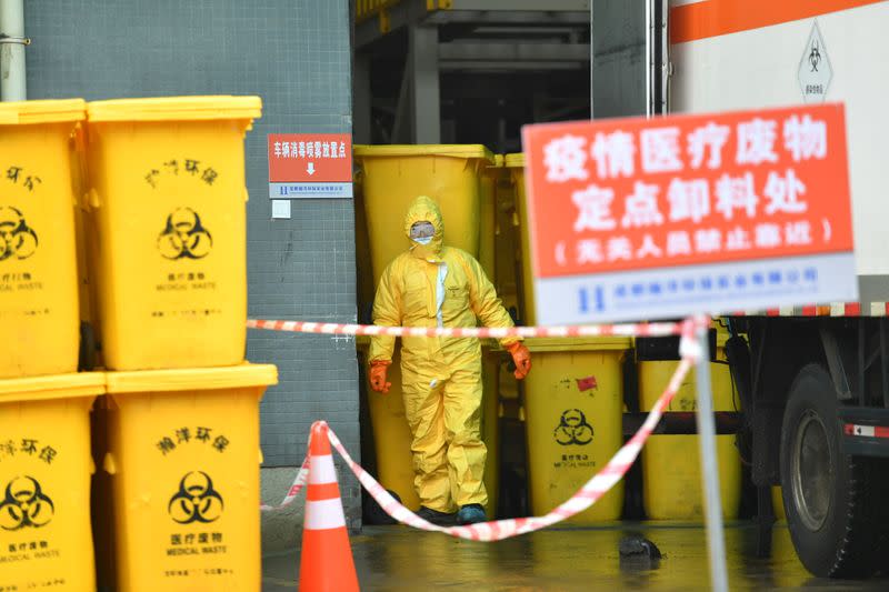 Worker in protective suit is seen at a medical waste disposal centre following an outbreak of the novel coronavirus in the country, in Chengdu