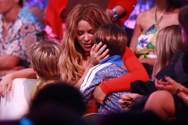 <p>Gladys Vega/Getty Images</p> Shakira hugs one of her sons at the 2023 Premios Juventud Awards