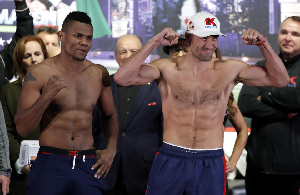 WBO light heavyweight champion Eleider Alvarez, left, of Colombia, and Sergey Kovalev, right, of Russia, pose for photos after their weigh-in in Frisco, Texas, Friday, Feb. 1, 2019. The two are scheduled to fight for the title on Saturday night. (AP Photo/Tony Gutierrez)