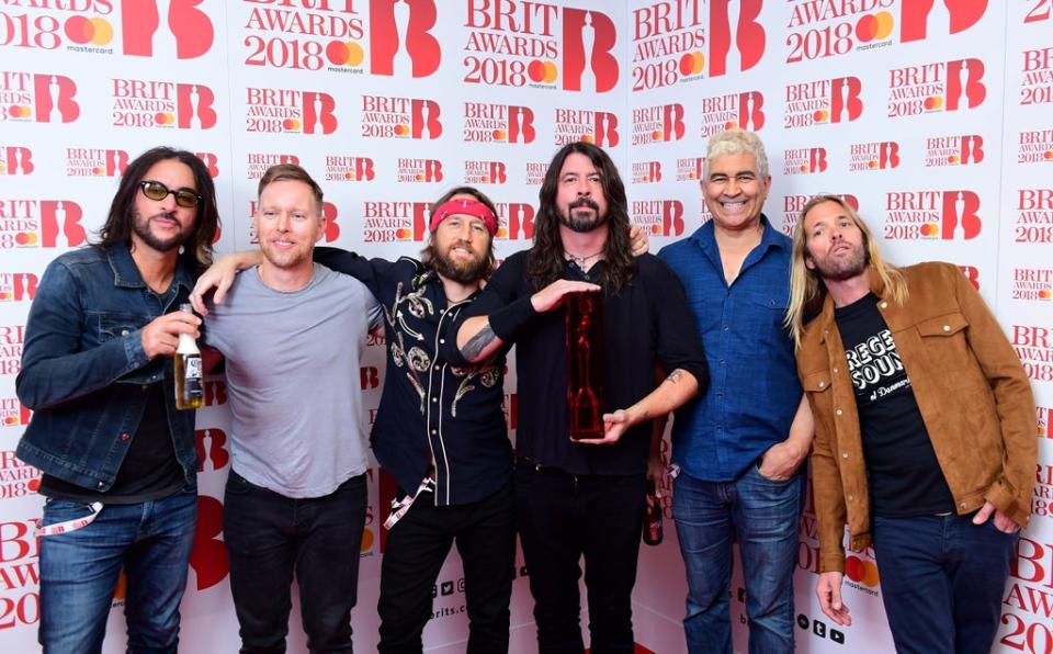 Foo Fighters with their award for Best International Group in the press room during the Brit Awards at the O2 Arena, London (Ian West/PA) (PA Archive)