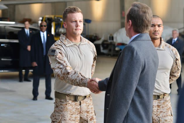 Robert Cormier shakes the hand of the president, played by Kiefer Sutherland, in 