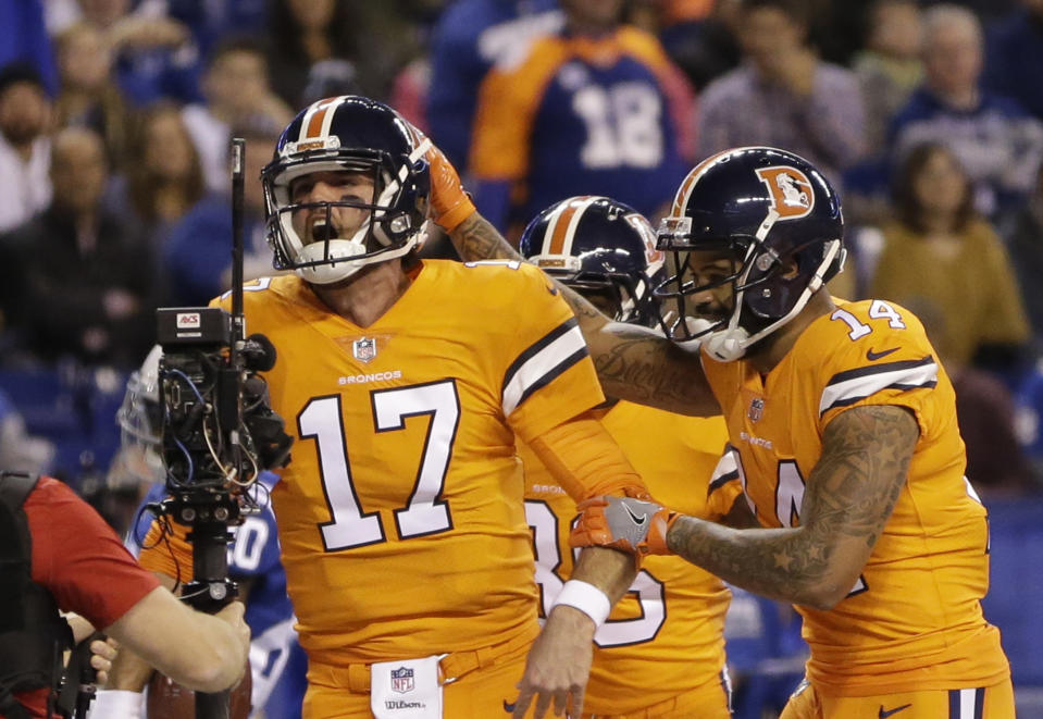 Denver Broncos quarterback Brock Osweiler (17) celebrates his rushing touchdown against the Colts. (AP)