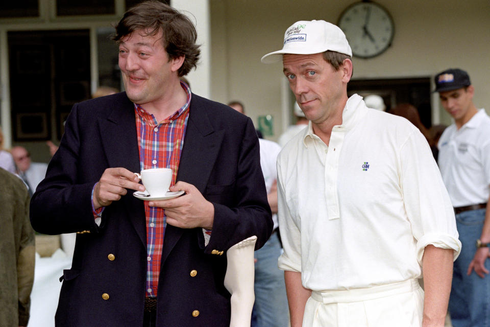 PA NEWS PHOTO 14/7/98 STEPHEN FRY (LEFT) AND HUGH LAURIE AT A CHARITY CRICKET MATCH IN AID OF MACMILLAN CANCER RELIEF. THE MACMILLAN GARTER MATCH TOOK PLACE AT BURTON'S COURT IN CHELSEA AND WAS FOLLOWED BY A CHAMPAGNE RECEPTION.   (Photo by Peter Jordan - PA Images/PA Images via Getty Images)