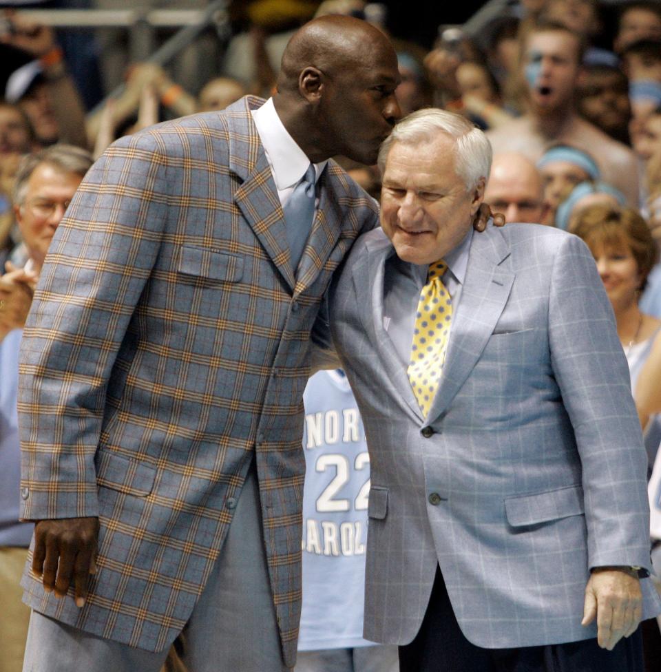 North Carolina coach Dean Smith, here with Michael Jordan, made Charlie Scott the school's first black scholarship athlete and one of the first in the segregated South.