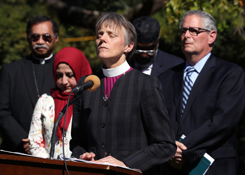 WASHINGTON, DC - OCTOBER 03: Rev. Mariann Budde, Bishop of the Episcopal Diocese of Washington leads a group of local religious leaders from many faiths in prayer during a vigil to protest gun laws in the wake of the mass shooting in Las Vegas, in the Bishop's Garden at the National Cathedral on October 3, 2017 in Washington, DC.   (Photo by Mark Wilson/Getty Images)