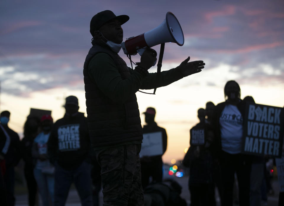 Tony Riddick addresses demonstrators at the intersection of Ehringhaus Street and Road Street during a march on Friday, April 23, 2021 in Elizabeth City, N.C. Several days of protests followed the shooting death of Andrew Brown Jr. on Wednesday by sheriff's deputies serving drug-related search and arrest warrants. (Robert Willett/The News & Observer via AP)