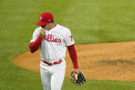 Philadelphia Phillies pitcher JoJo Romero wipes his face after being pulled during the fifth inning of baseball game against the Milwaukee Brewers, Wednesday, May 5, 2021, in Philadelphia. (AP Photo/Matt Slocum)