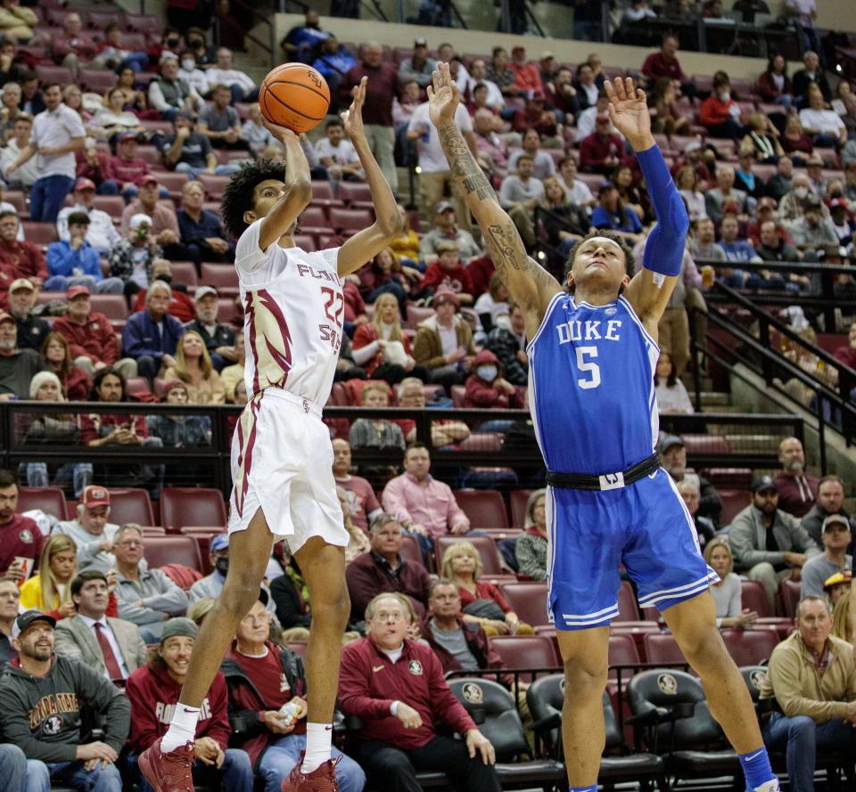 Florida State Seminoles forward John Butler (22) shoots for three. The Florida State Seminoles defeated the Duke Blue Devils 79-78 in overtime at the Donald L. Tucker Civic Center on Tuesday, Jan. 18, 2022.