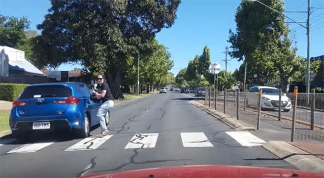 The car was centimetres from knocking the woman down. Image: YouTube