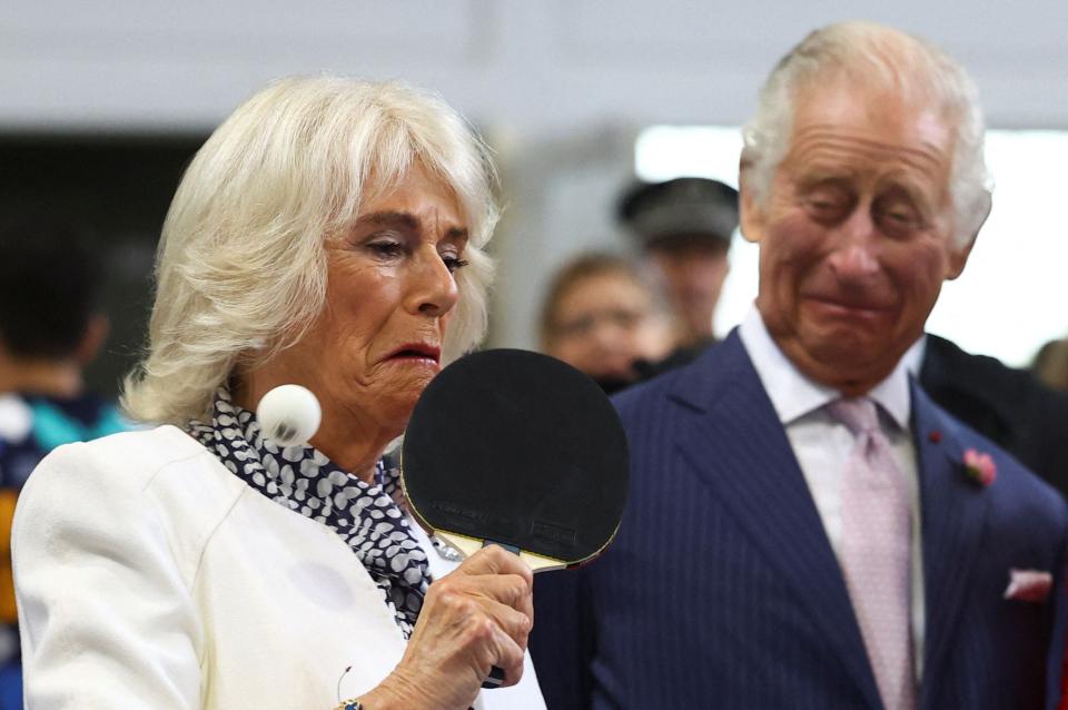 The Queen laughed as she struggled to hit the ball over the net (POOL/AFP via Getty Images)