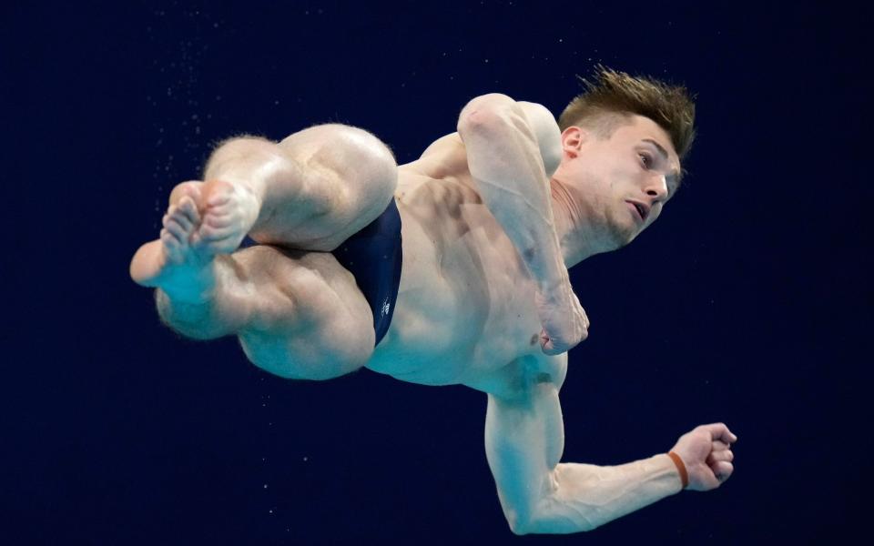 Jack Laugher of Britain competes in men's diving 3-meter springboard final at the 2020 Summer Olympics - AP