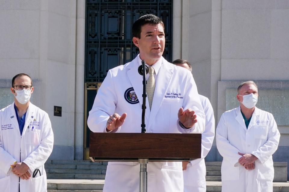 Dr. Sean Conley, physician to President Donald Trump, briefs reporters at Walter Reed National Military Medical Center in Bethesda, Md., Sunday, Oct. 4, 2020. Trump was admitted to the hospital after contracting the coronavirus. (AP Photo/Jacquelyn Martin)