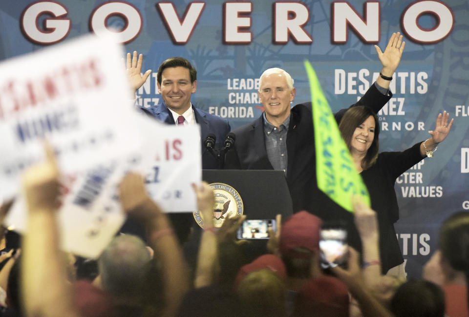 Florida Republican gubernatorial candidate Ron DeSantis waves to the crowd at his Jacksonville, Fla., campaign rally where he was joined Vice President Mike Pence and his wife Karen Pence Thursday, Oct. 25, 2018. (Bob Self/Florida Times-Union via AP)